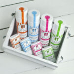 a box filled with lots of different colored markers
